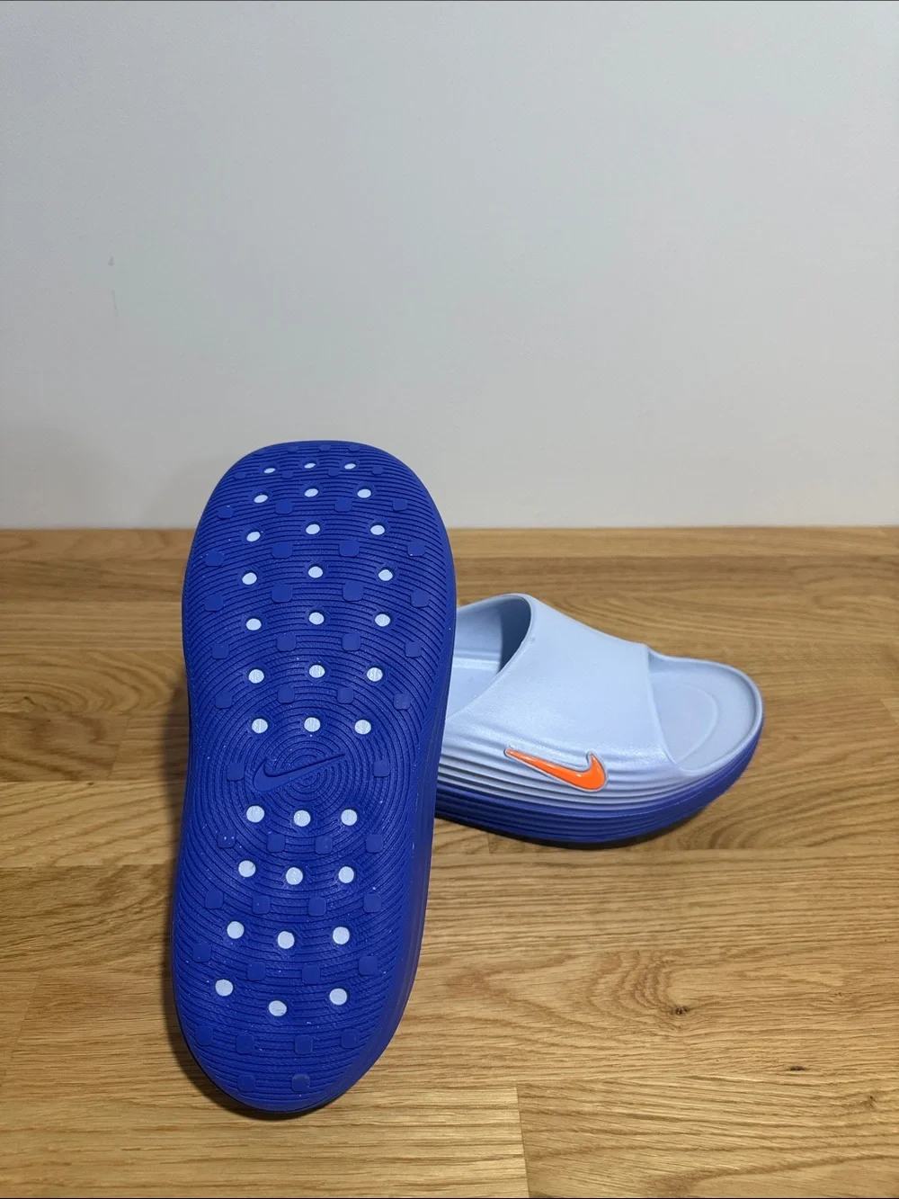 Brand new men’s size 9 Nike Rejuven8 Light Blue Slide Sandals with Orange Swoosh